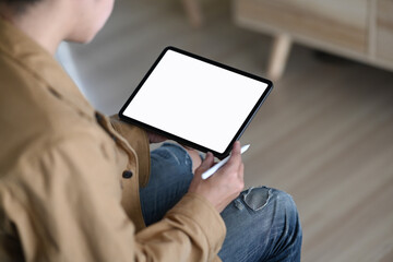 Cropped shot man holding digital tablet empty screen and stylus pen