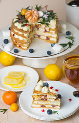 Honey cake pieces on a plate with lemon tea for dessert