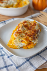 home made tasty cannelloni pumpkin on a table