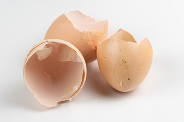 eggshells of beaten chicken eggs on a white background