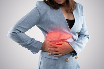 The photo of liver on woman's body against gray background, Hepatitis, Concept with healthcare and...