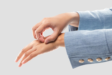 Businesswoman scratching her back of hand because of the itching from irritation.