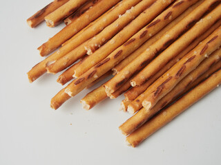 breadsticks in a cup on a wooden background
