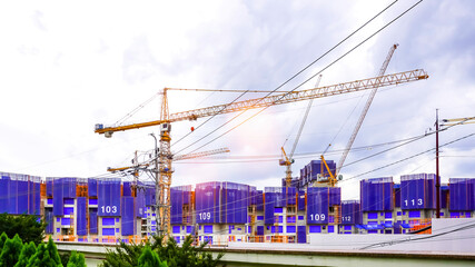Tower crane at a construction site building an apartment