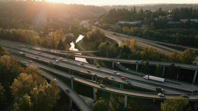 Drone View of Freeway Overpass Ramps Over River at Sunset