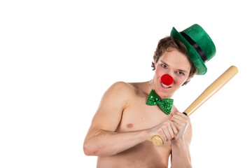 Funny guy in a clown costume. Holidays and fun. Young attractive man on a white background.
