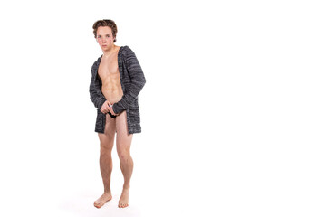 Fitness and healthy lifestyle. Diet and sport of a handsome guy. Young attractive man on a white background.