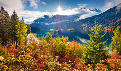 Beautiful autumn scenery. Astonishing morning view of Eibsee lake with Zugspitze mountain range on background. Great autumn scene of Bavarian Alps, Germany, Europe.