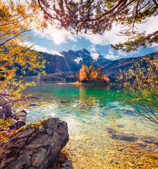 Landscape photography. Picturesque summer view of Eibsee lake with Zugspitze mountain range on background. Stunning autumn scene of Bavarian Alps, Germany. Beautiful autumn scenery.