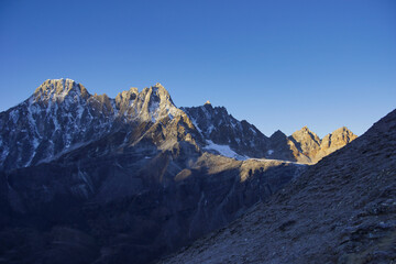 Pharilapcha Peak and renjo la pass (part of the three passes trek) in golden sunrise light. Photographed from Gokyo Ri peak.