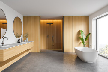 White and wooden bathroom with tub, sink and shower