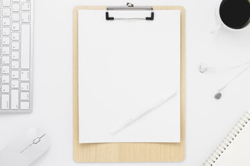 Fototapeta na wymiar Minimal Office desk table top view with office supply and coffee cup on a white table with copy space, White color workplace composition, flat lay