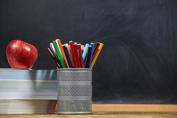 red apple, books and penciles on wooden table and blackdoard background.school for kids. - 402801027