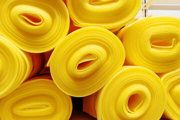 Polyethylene foam backing in rolls. Trade in building materials in a store. Close-up