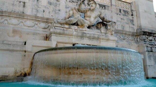 Sightseeing the large fountain with the statue symbolizing the Adriatic Sea in front of Vittoriano