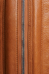 Unzipped line on brown leather