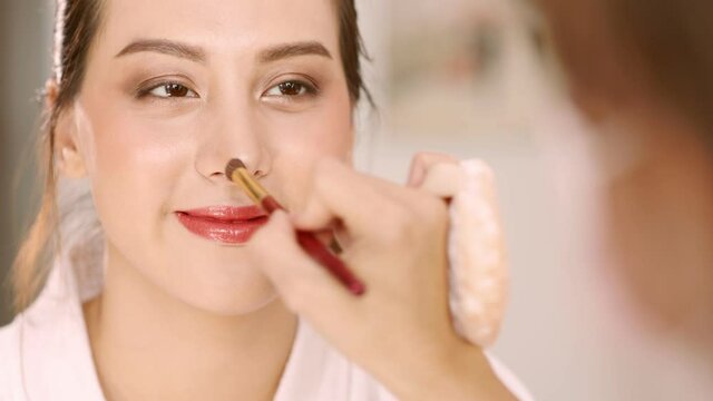 Happy attractive asian woman apply skincare cream on face and body.Female  hand touch face  and smooth applying cream and lotion for rejuvenation, beauty perfect with wellness, skin care .