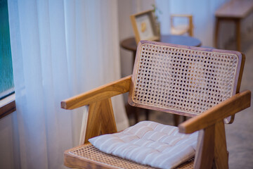 Wooden chair with sunlight near the window in the room