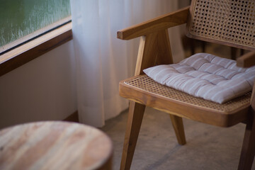 Wooden chair with sunlight near the window in the room