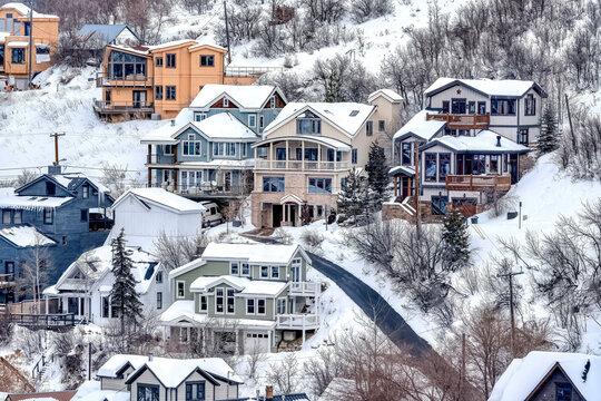 Aerial View Of Snowy Neighborhood In Winter On A Mountain Town With Houses