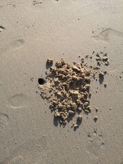 A crab hole on the beach