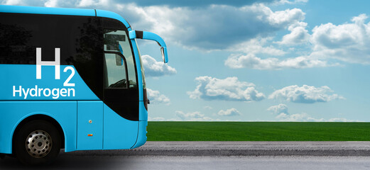Tourist bus on hydrogen fuel with green field and blue sky background