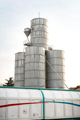 Silo for corn, hazelnuts, legumes and railway wagon behind it