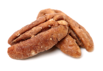 Peeled pecan nuts closeup, isolated on white background