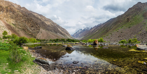 Fototapeta na wymiar Lake in Jizev (Jisev or Jizeu) valley in Pamir mountains, Tajikistan