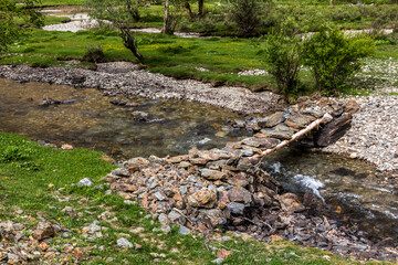 Footbridge in Jizev (Jisev or Jizeu) valley in Pamir mountains, Tajikistan
