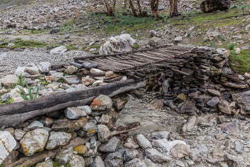 Footbridge in Jizev (Jizeu, Geisev or Jisev) valley in Pamir mountains, Tajikistan