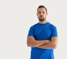 Fototapeta premium Serious man in t shirt isolated on white background. Fitness trainer teach about healthy lifestyle.