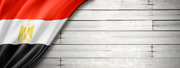 Egyptian flag on old white wall banner