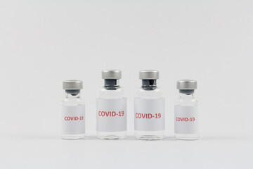Corona virus vaccine in bottles on white background, COVID19