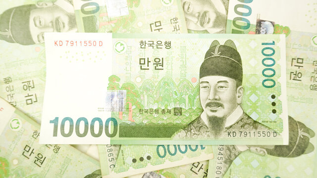 Korean money 10,000 Won cash currency background. The concept of Korean cash currency.