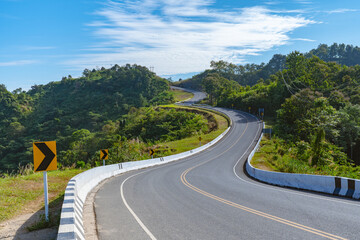 beutiful road curve in countryside undr blue sky in summer