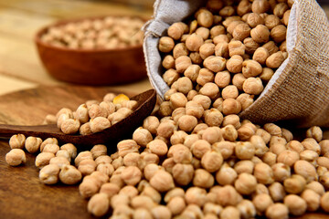 Organic chickpeas falling out of the sack