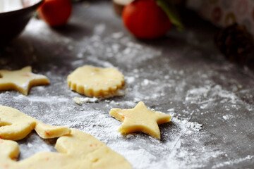 Cooking cookies for the new year and christmas. Flour and dough, cookie cutters. Top view. Copy space