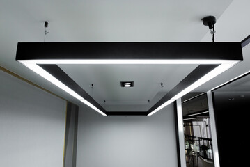LED white cold light over workplaces. Modern office lighting.