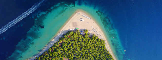 Aerial drone ultra wide photo from paradise organised bay and sandy beach of Gregolimano, North...