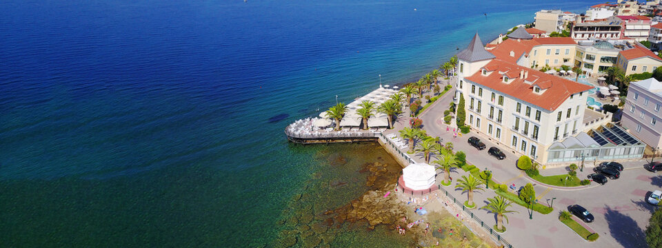 Aerial drone ultra wide photo of famous seaside village well known for thermal springs of Aidipsos, North Evia island, Greece