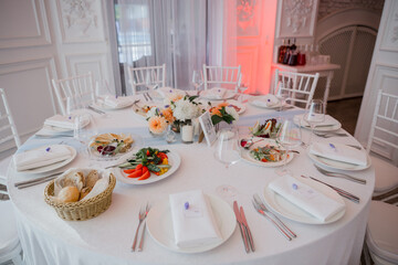 wedding table in a restaurant with decor and food