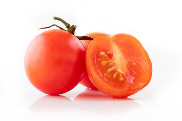 Fresh cherry tomatoes on a white background