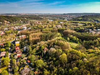 Fototapeta na wymiar Aerial view of village Sedlec Suchdol, part of Prague 6 with view on Prague and Prague Castle