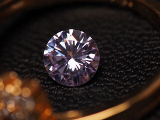 Close up shoot of beautiful, shiny, multi colored diamonds crystal gemstones, shoot on black leather as background