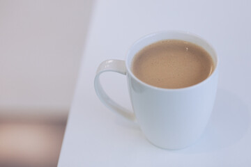 Obraz na płótnie Canvas white mug full of coffeee