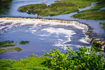  View of Venta rapid in Kuldiga, Latvia in summer.  Widdest waterfall in Europe