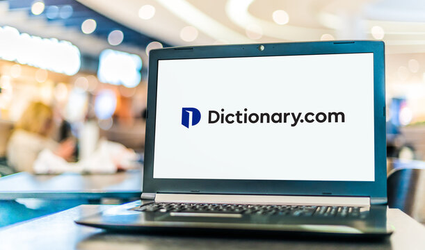 Laptop Computer Displaying Logo Of Dictionary.com