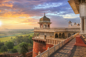 Agra Fort - Medieval Indian fort made of red sandstone and marble at sunrise Agra Fort is a UNESCO...