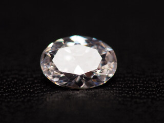 Close up shoot of group of sparkling diamonds, shoot on black leather as background